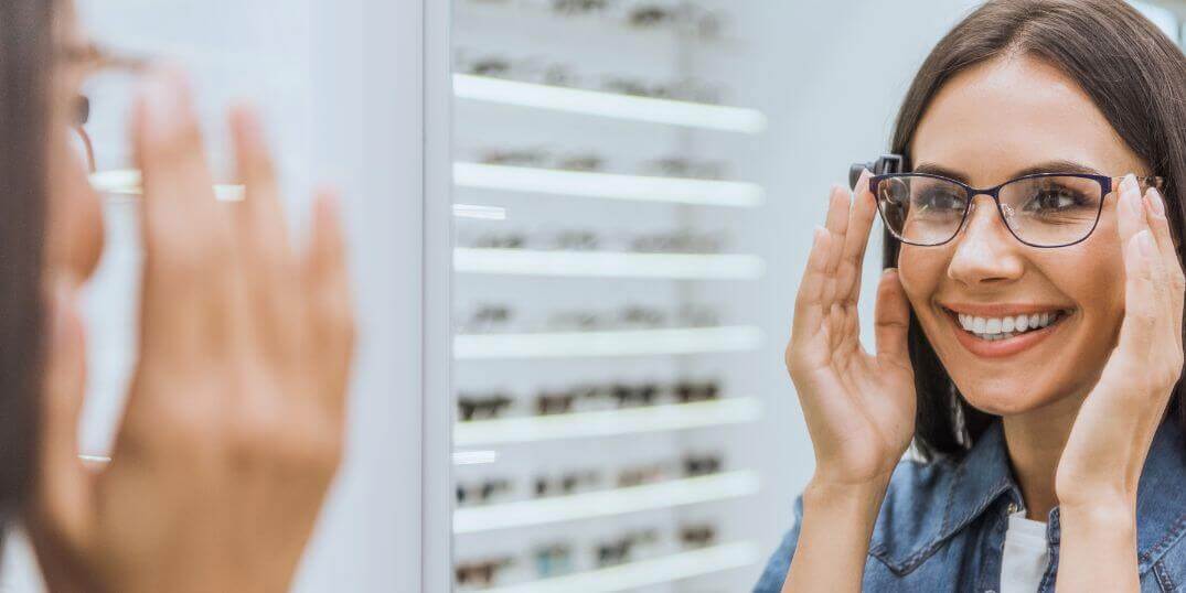 Woman trying on glasses